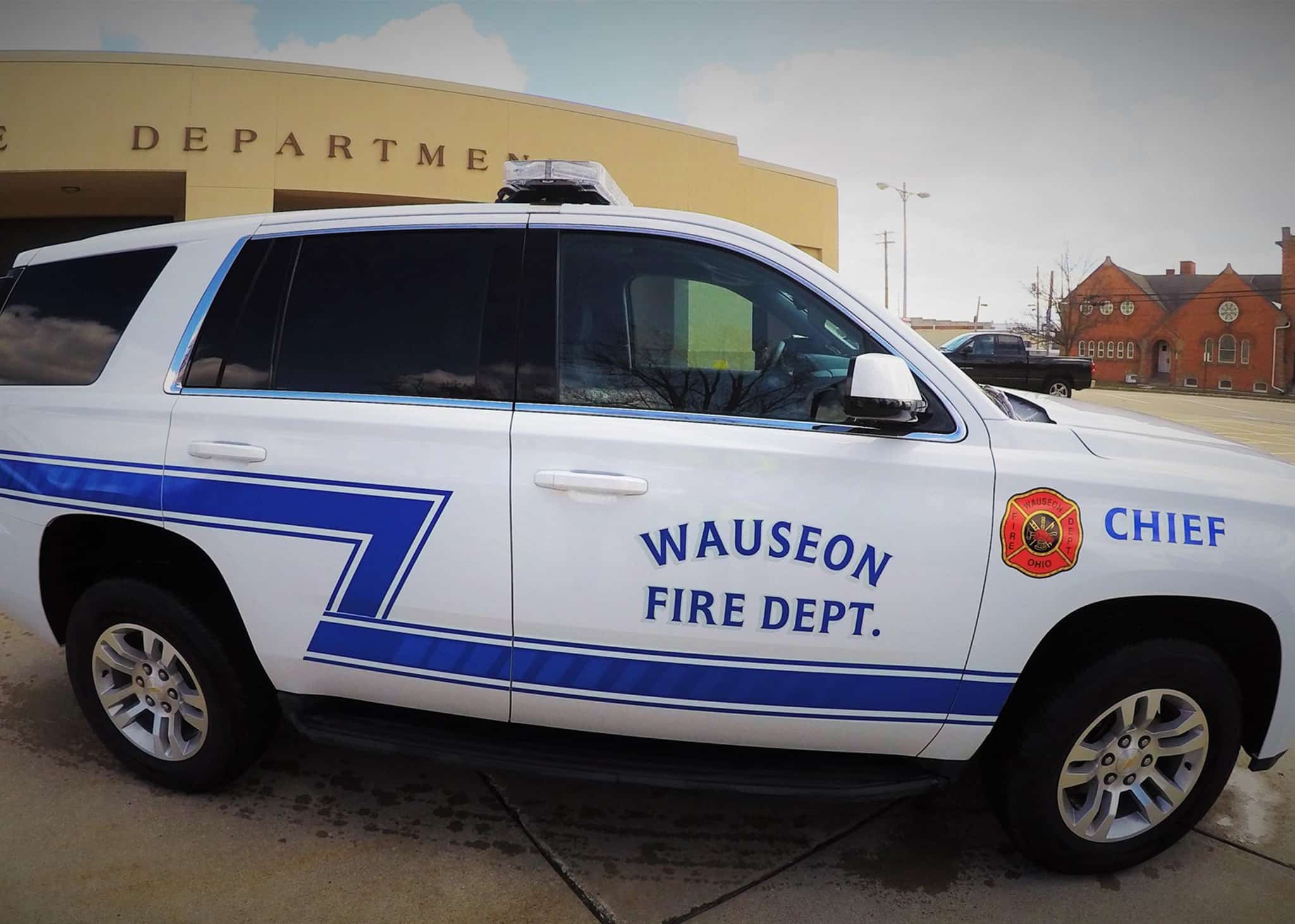 The Fire Chief's sport utility vehicle parked in front of the fire station.